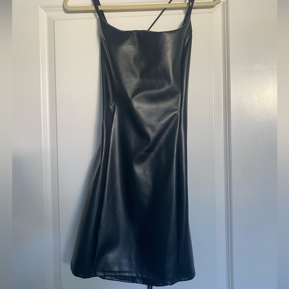 Black leather cross bsck Lucy in the sky fress fits like a M